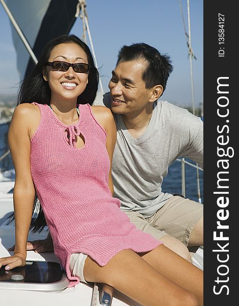 Asian ethnic Couple on sailboat