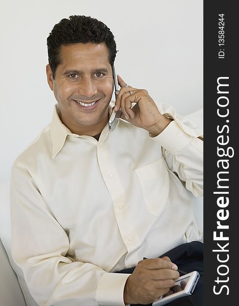 Businessman With PDA and Cell Phone