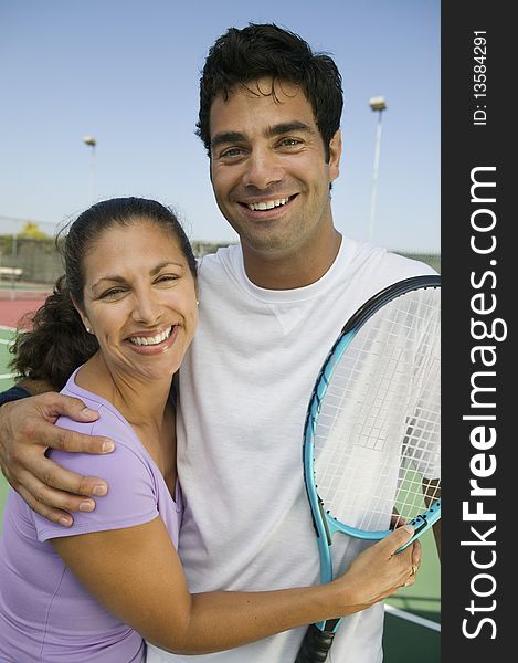Mixed doubles Tennis Players on tennis court, portrait