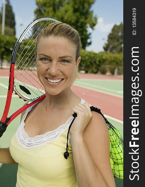 Woman with Tennis Racket and Tennis Balls