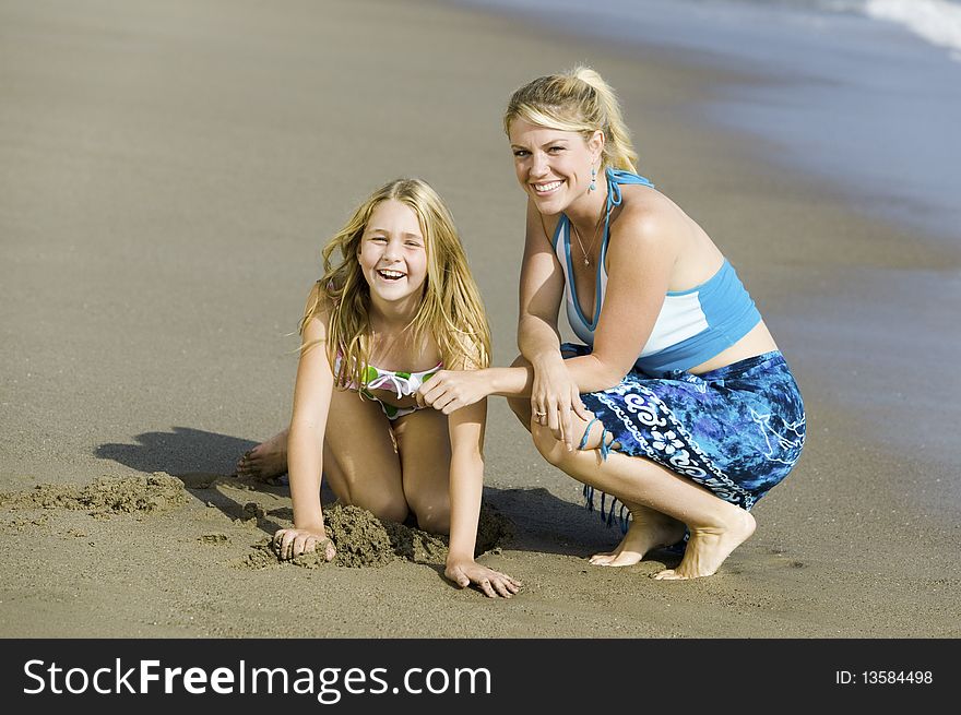 Mother and Daughter Together on Beach. Mother and Daughter Together on Beach