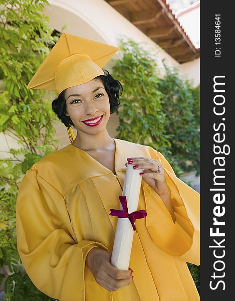 Graduate Holding Diploma Outside