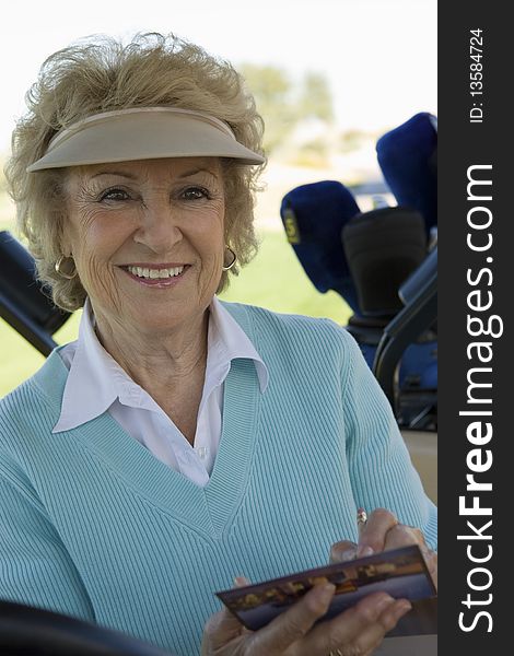 Senior Woman Holding Golf Score Card