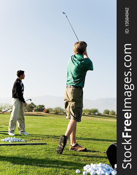 Two Man Practising Golf