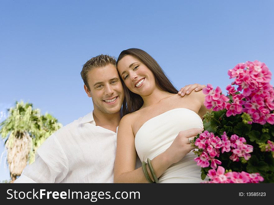 Young Couple With Potted Flower