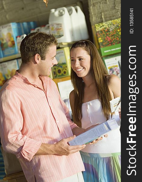 Young couple in garden centre