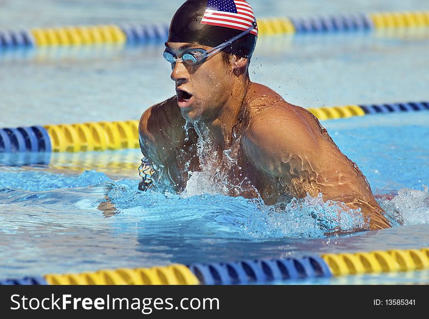 Competitive male Swimmer in outdoor pool. Competitive male Swimmer in outdoor pool