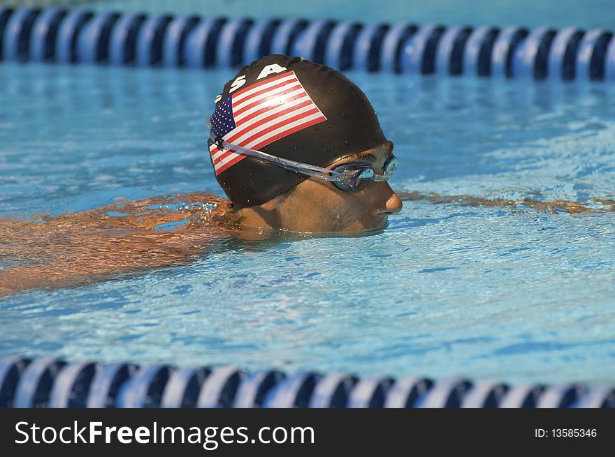 Competitive American Swimmer in outdoor pool. Competitive American Swimmer in outdoor pool