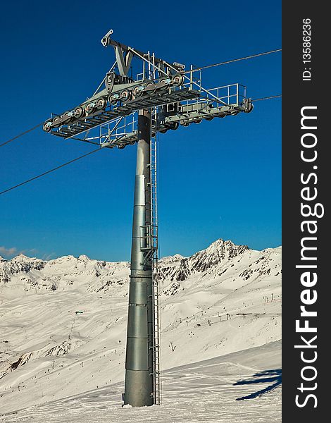 Ski lift pole with support rolls.