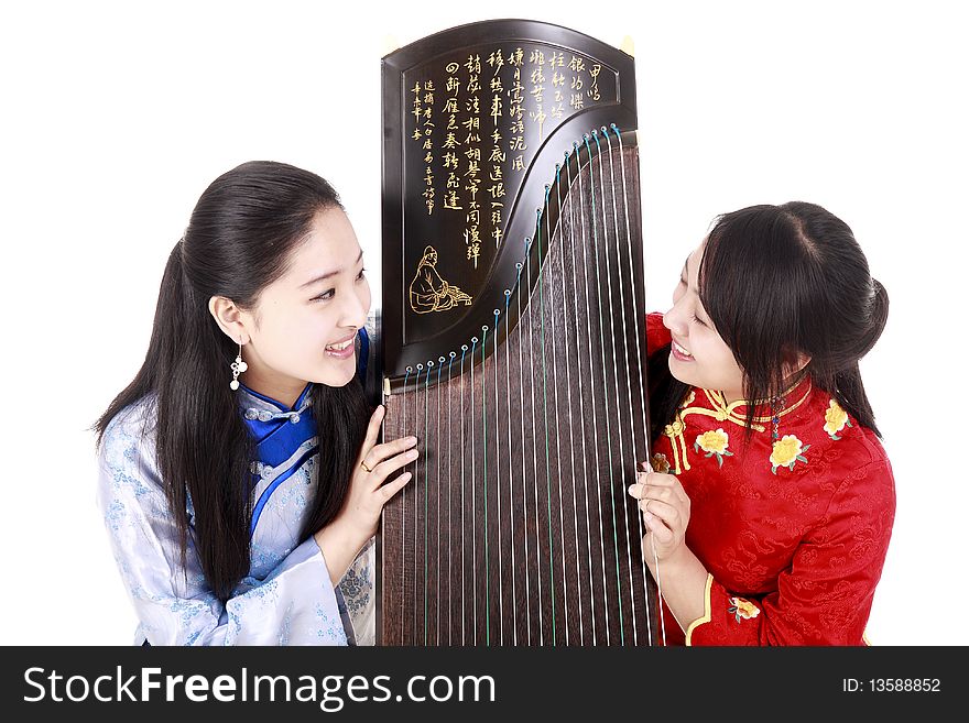 Two Chinese musicians with bamboo flute and zither talking on white.


Chinese character on zither is Chinese Tang poetry,also a famous Tang Dynasty poet's calligraphy. It praised the unique charm of the zither. Two Chinese musicians with bamboo flute and zither talking on white.


Chinese character on zither is Chinese Tang poetry,also a famous Tang Dynasty poet's calligraphy. It praised the unique charm of the zither.