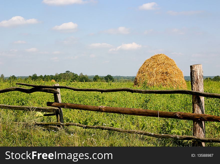 An image of yellow haystack in the field