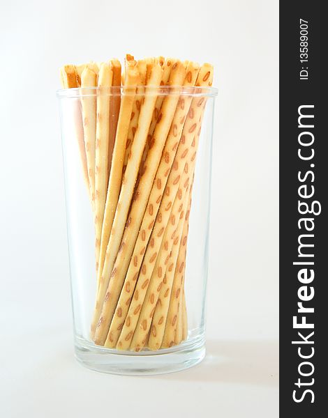 A famous asian snack called cracker sticks served in a cup.