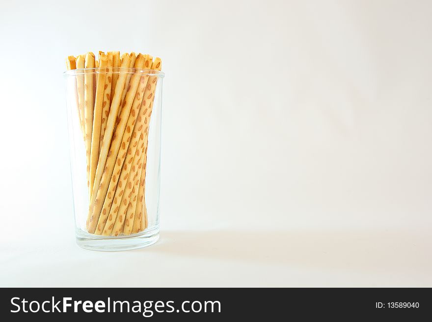 A famous asian snack called cracker sticks served in a cup.