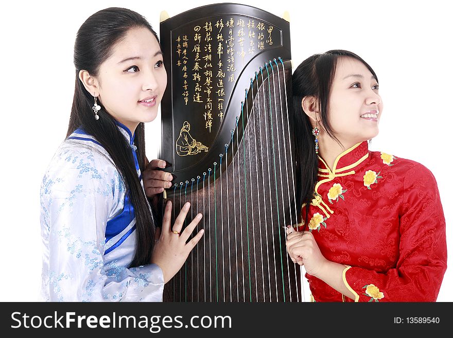 Two Chinese musicians with bamboo flute and zither talking on white.


Chinese character on zither is Chinese Tang poetry,also a famous Tang Dynasty poet's calligraphy. It praised the unique charm of the zither. Two Chinese musicians with bamboo flute and zither talking on white.


Chinese character on zither is Chinese Tang poetry,also a famous Tang Dynasty poet's calligraphy. It praised the unique charm of the zither.