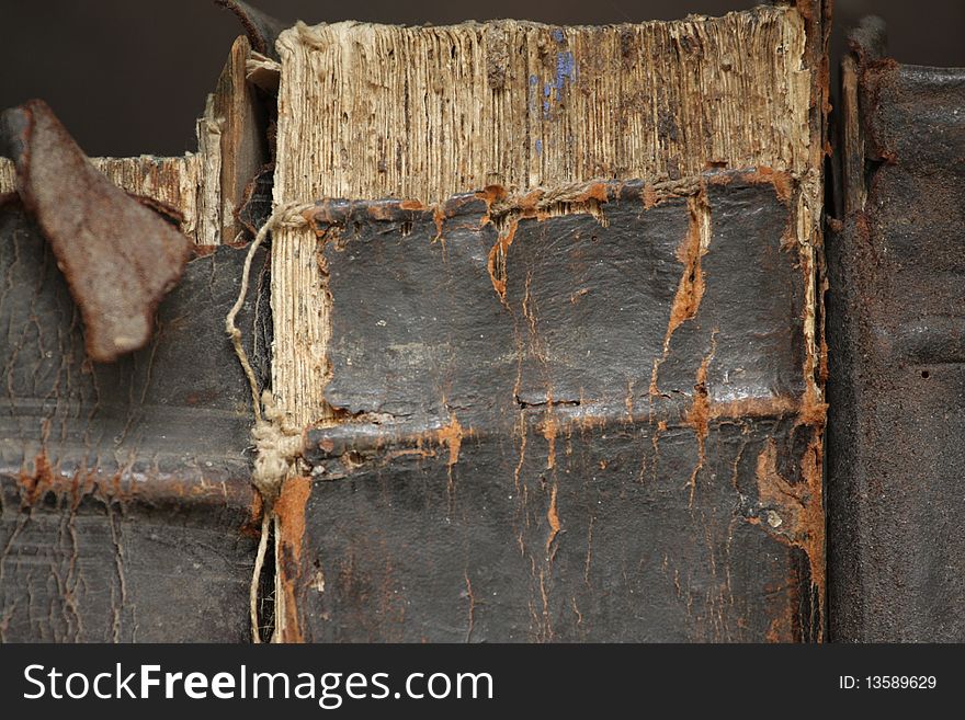 Three old books with tattered bindings