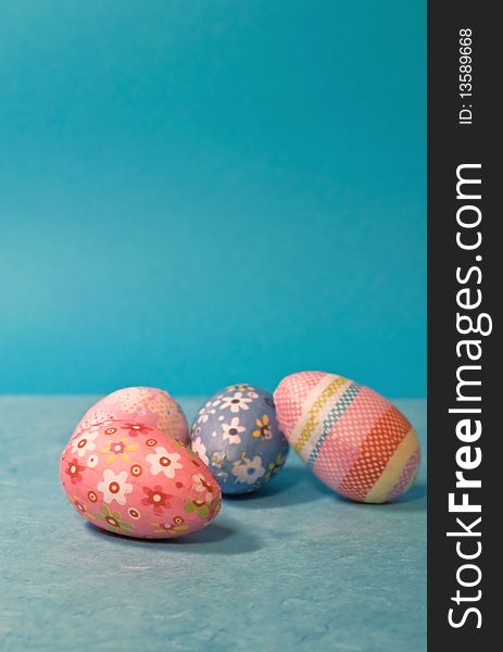 Decorated easter eggs on blue background/vertical