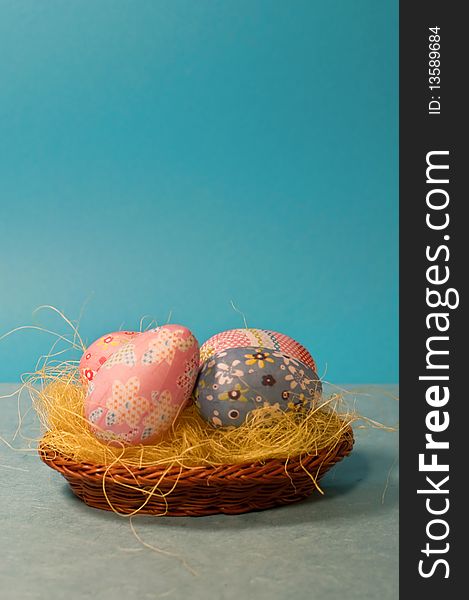 Decorated easter eggs on blue background/vertical