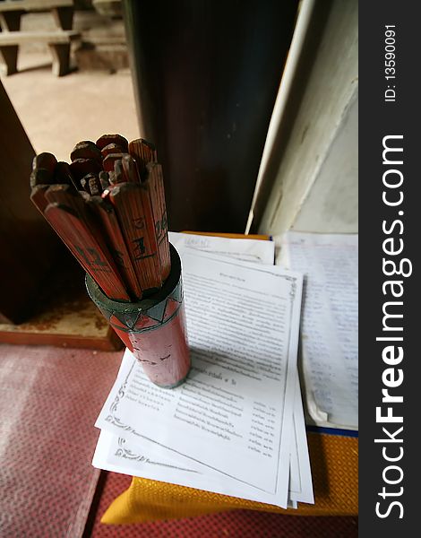 Chinese fortune teller with result paper in Thai temple. Chinese fortune teller with result paper in Thai temple