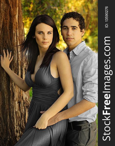 Portrait of beautiful young woman and man in outdoor setting. Portrait of beautiful young woman and man in outdoor setting