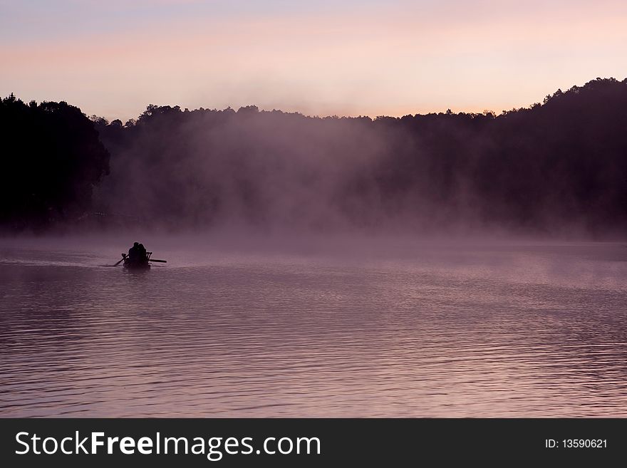 Kayak At Sunrise With Fog