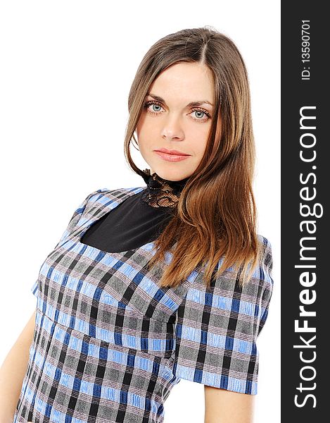 The positive young woman in a dress with long hair on a white background