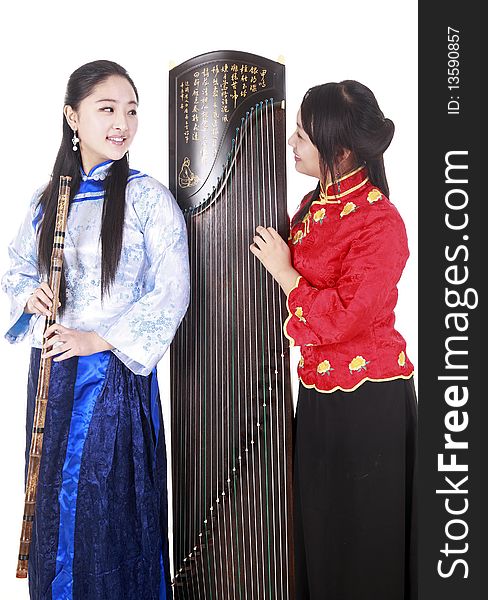 Two Chinese musicians with bamboo flute and zither talking on white.

Chinese characters on the flute means
wonderful voice,it is taken from one of China's ancient poetry.

Chinese character on zither is Chinese Tang poetry,also a famous Tang Dynasty poet's calligraphy. It praised the unique charm of the zither.