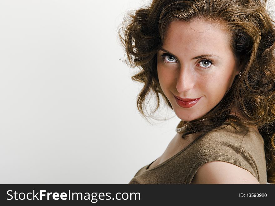 Close-up portrait of a young attractive woman that looking at camera