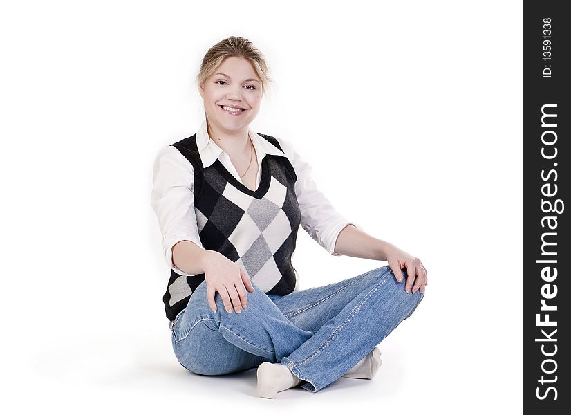 Woman sitting on floor, studio portrait