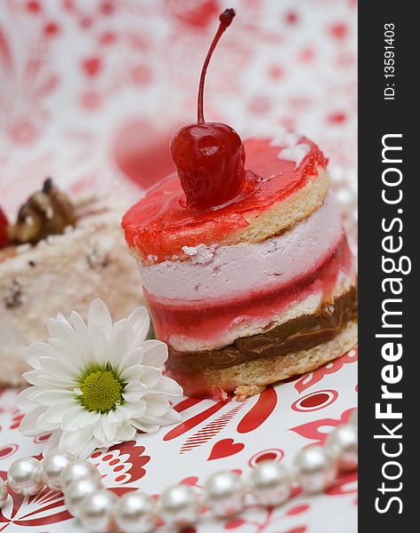 Shot-cut sweet fruit red cake with cherry and white camomile. Shot-cut sweet fruit red cake with cherry and white camomile