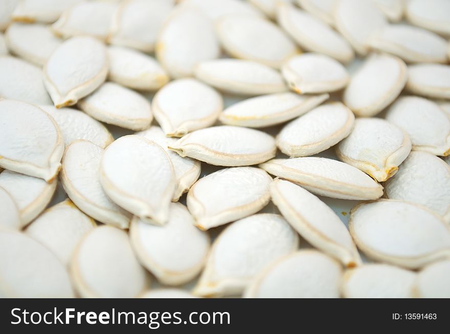 Unhulled pumpkin seeds (can be used as a background)
