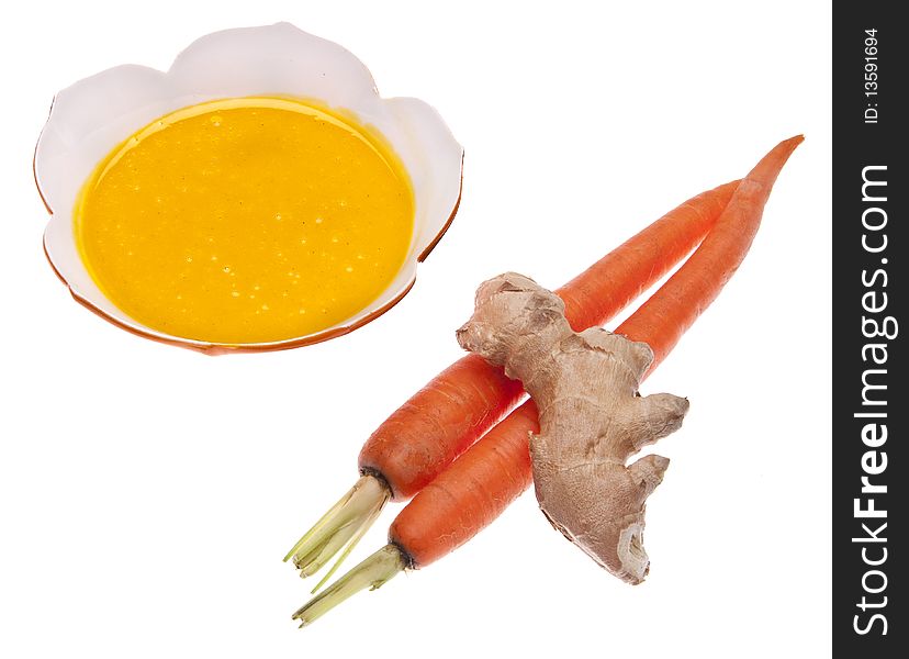 Ginger and carrot soup with ginger and carrot garnish.  isolated on white with a clipping path.