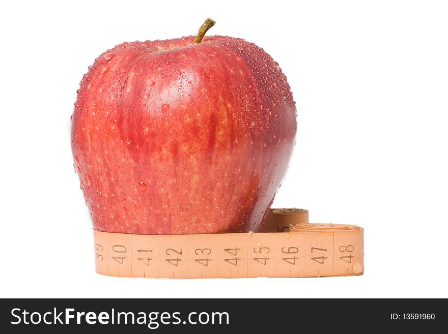 Apple with a ruler on a white background