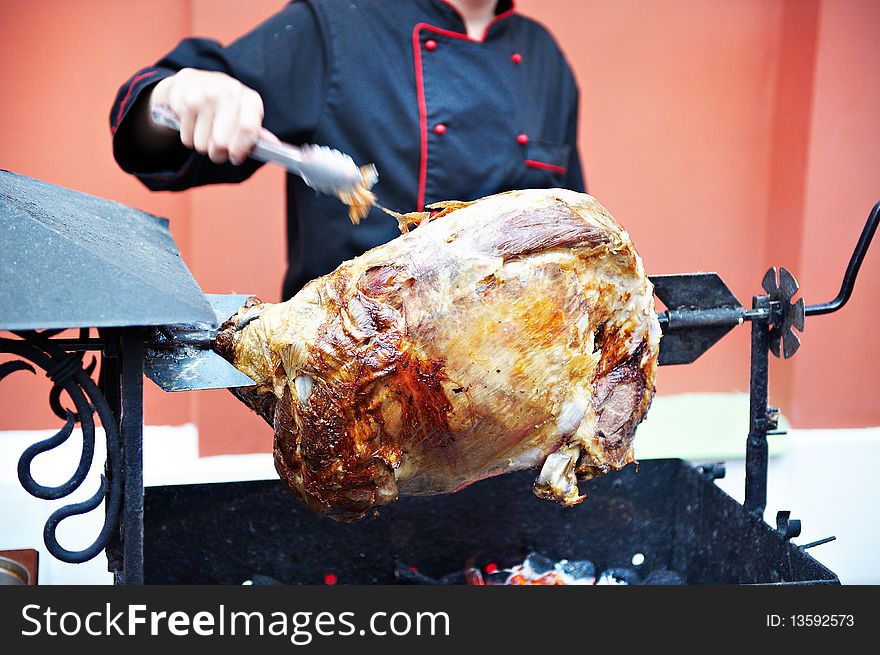 Carcass roasted lamb on a spit and cook