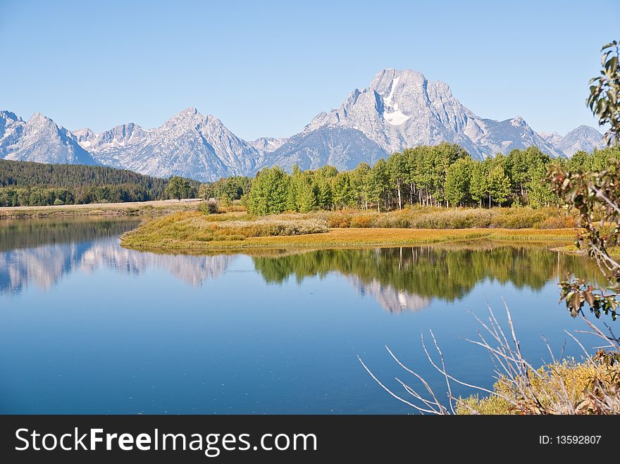 Grand Teton mountains and reflections on Snake River's Oxbow Bend. Grand Teton mountains and reflections on Snake River's Oxbow Bend