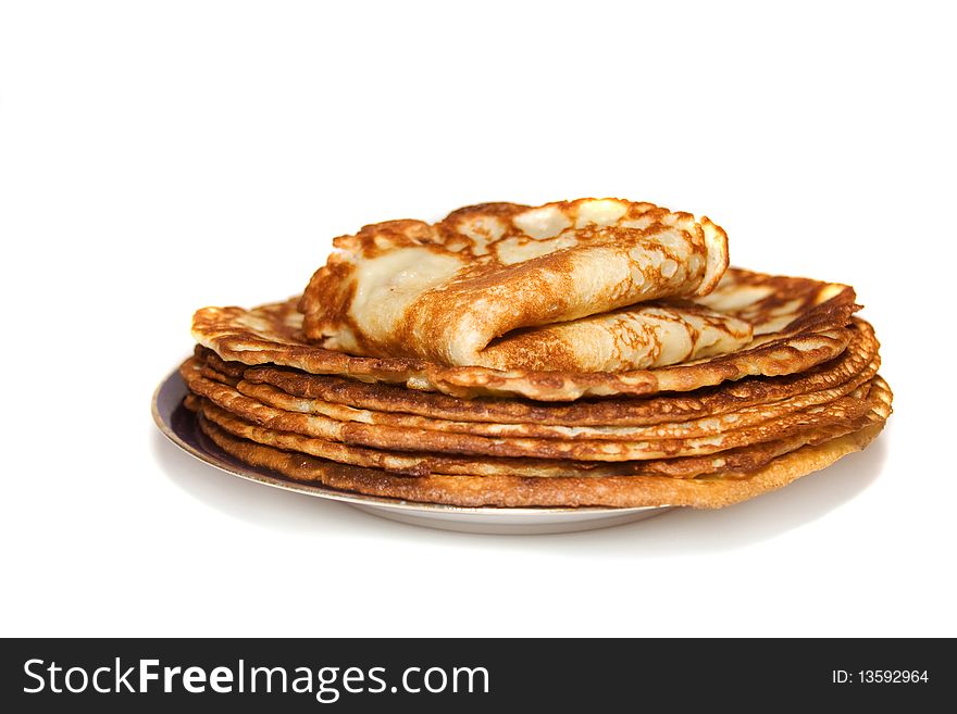 Pile of russain pancakes on the blue plate. Pile of russain pancakes on the blue plate