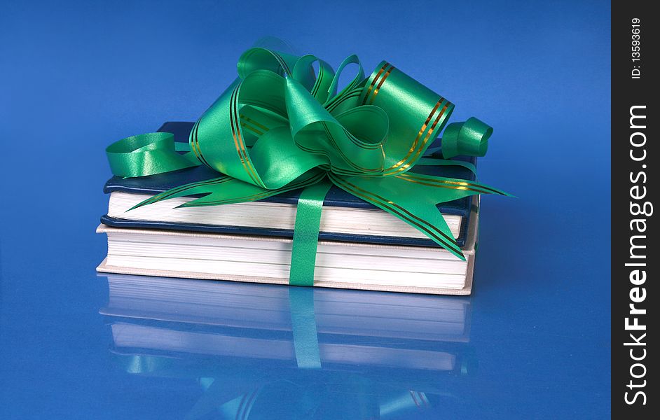 Color books, tied to a gift.