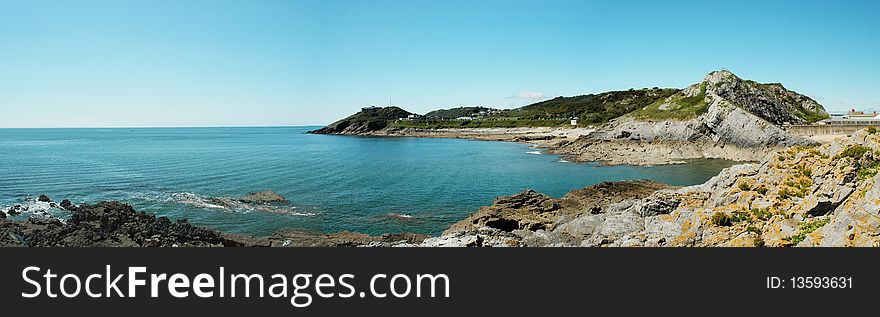 Panorama of coast of Swansea in Wales with blue sky. Panorama of coast of Swansea in Wales with blue sky