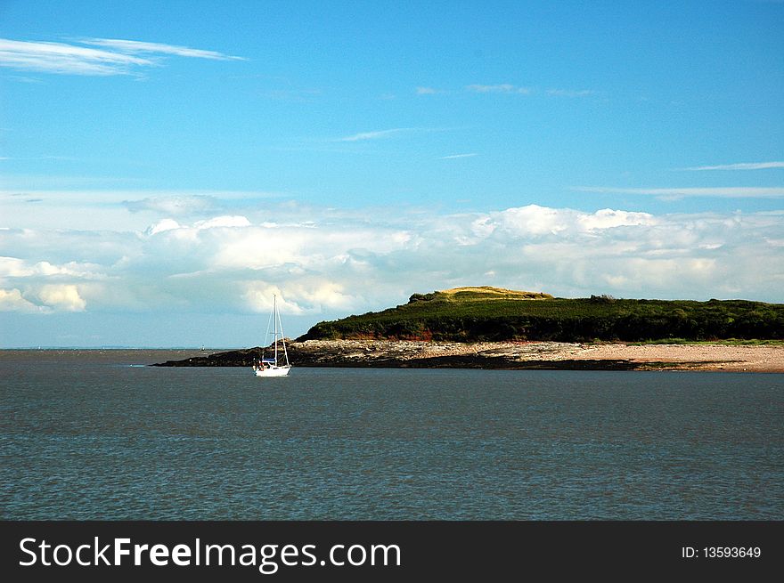 Sully island and sea, horizontally framed picture with boat