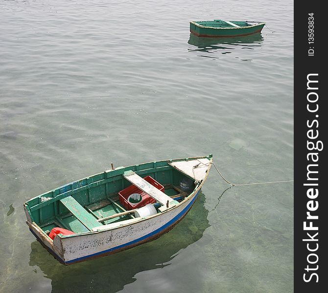 Small wood boats stopped in the water