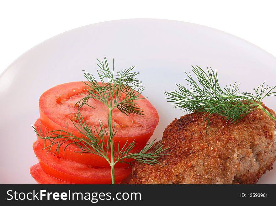 Ready cutlets are laid out on a white plate with a fennel branch.