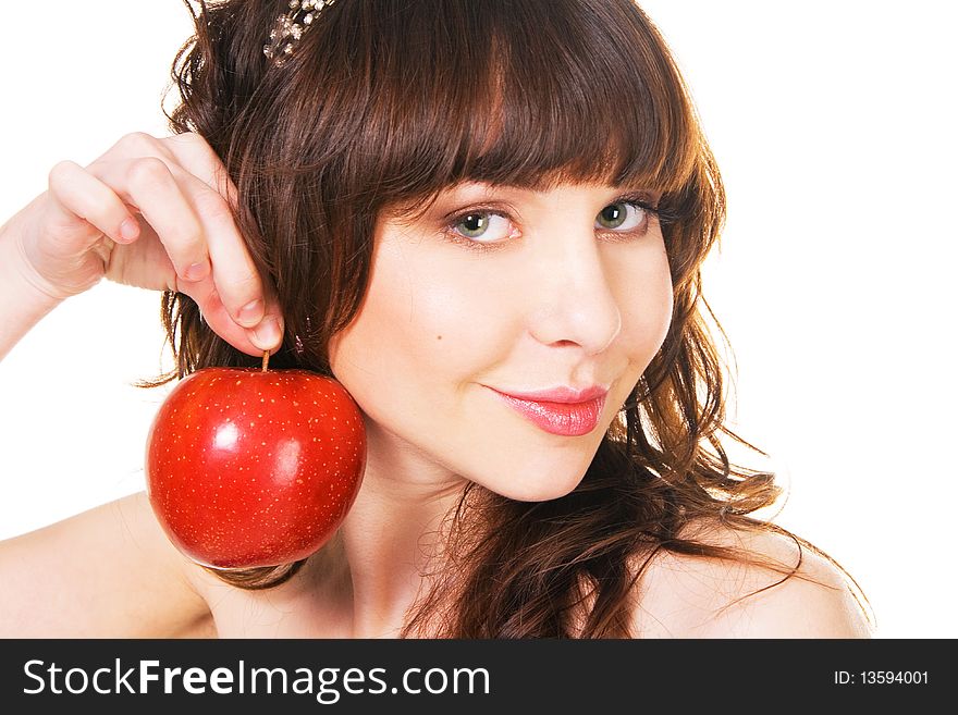 Portrait of lovely young girl holding a ripe red apple