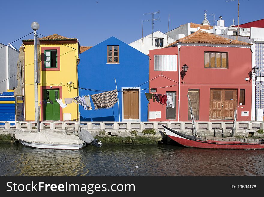 Detail of old houses facade in yellow, red and blue (near water channel)