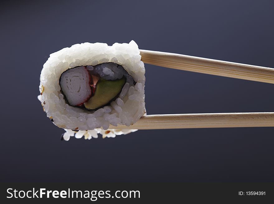 Fresh sushi over wooden background.