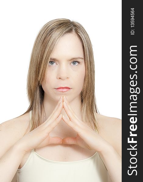 Head shot of girl looking straight at camera in yoga meditation pose. Studio shot on white background. Head shot of girl looking straight at camera in yoga meditation pose. Studio shot on white background.