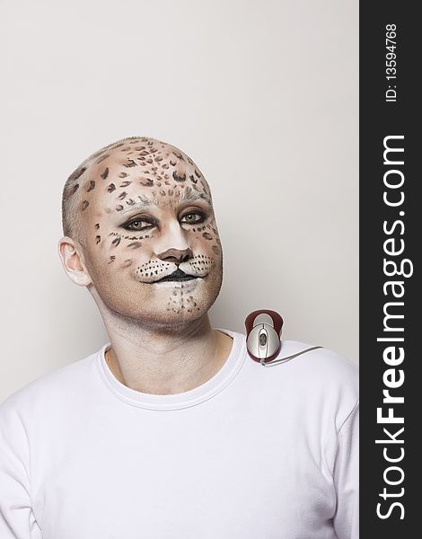 Man painted face like leopard