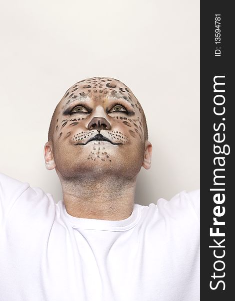 Man painted face like leopard