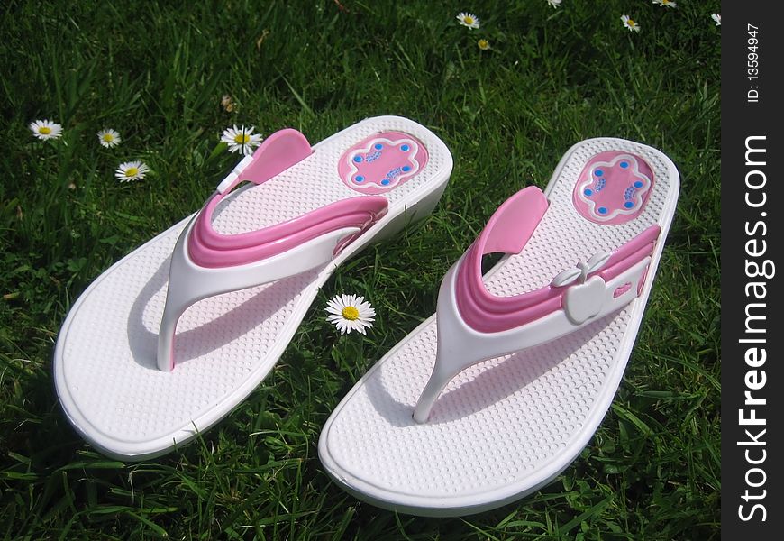 White sandals on green grass