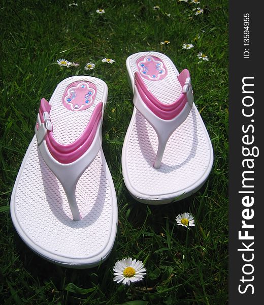 Summer sandals on green grass