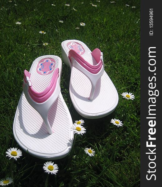 White sandals on green grass