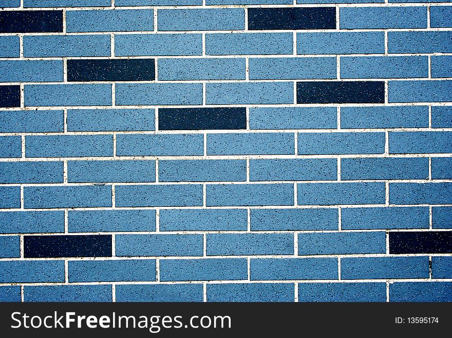 Blue and black brick wall